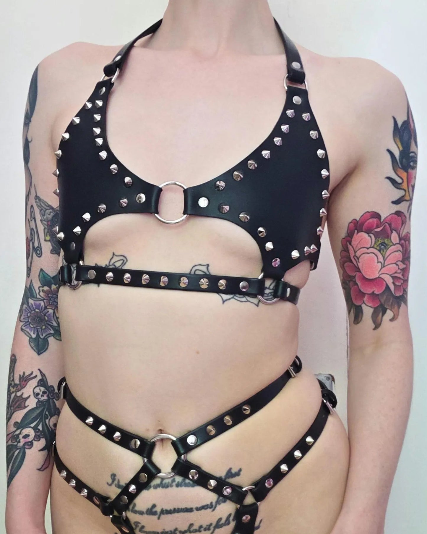 Cut out studded spike o-ring cage bra